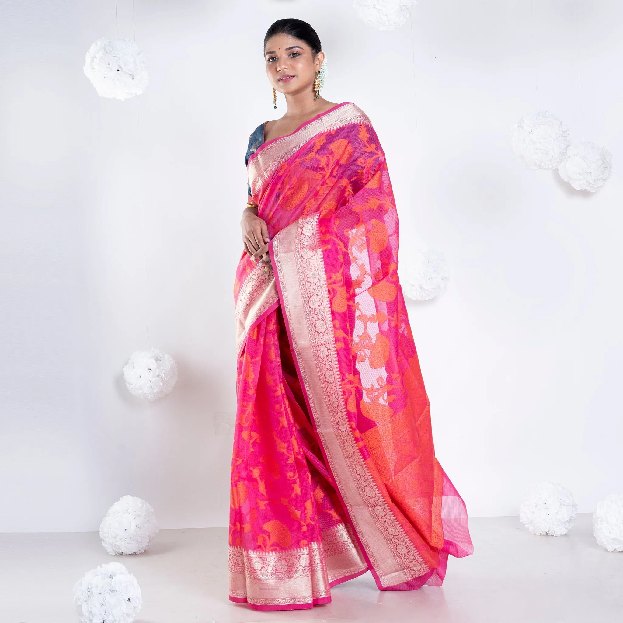 Women Banarasi Kora Cotton Saree In Hot Pink Color With Floral Jaal And Golden Border